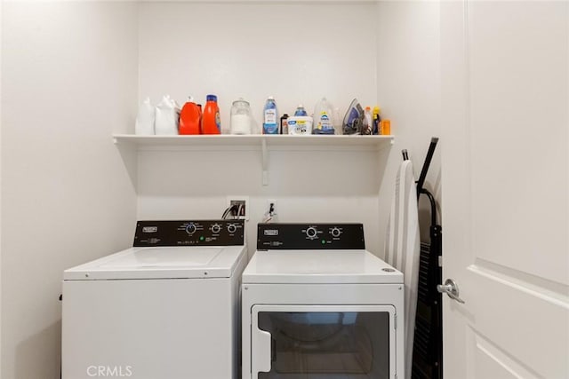 laundry area with laundry area and washer and clothes dryer