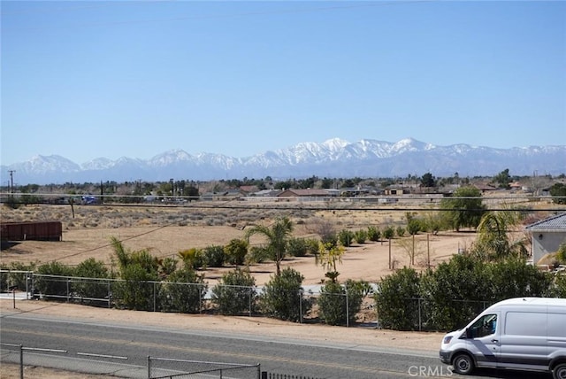 view of mountain background featuring rural landscape