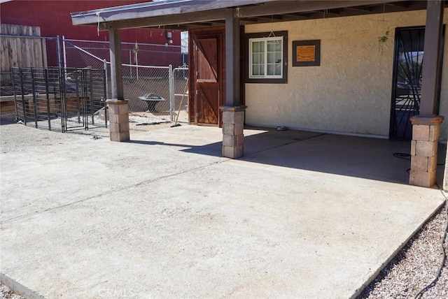view of patio featuring fence