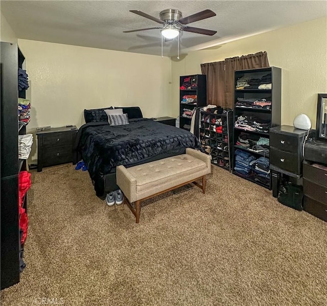 carpeted bedroom featuring a ceiling fan