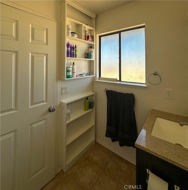 bathroom featuring tile patterned floors and vanity