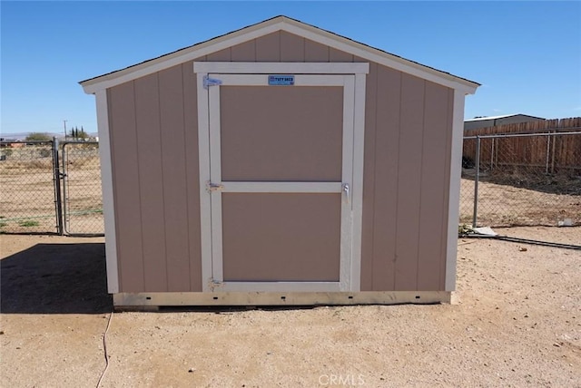 view of shed with fence