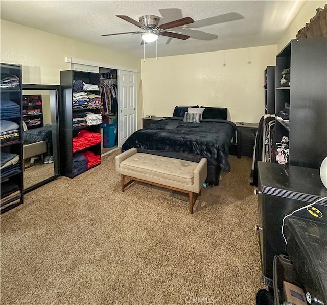 bedroom featuring carpet floors, a ceiling fan, and a closet