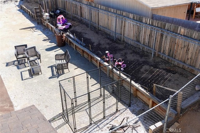 view of patio / terrace with fence and a gate