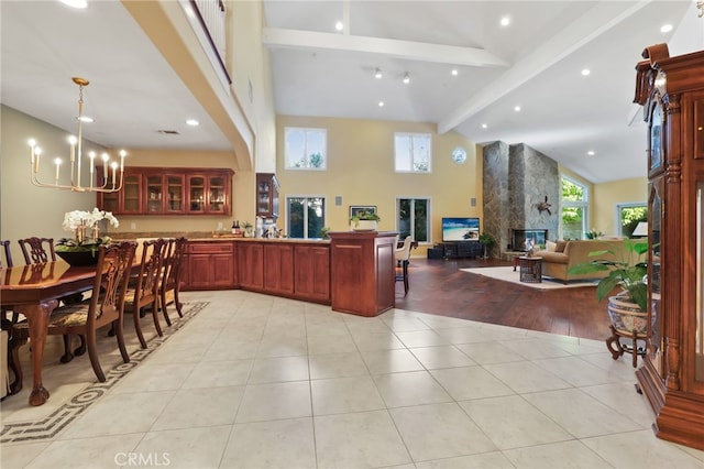 interior space with a large fireplace and an inviting chandelier