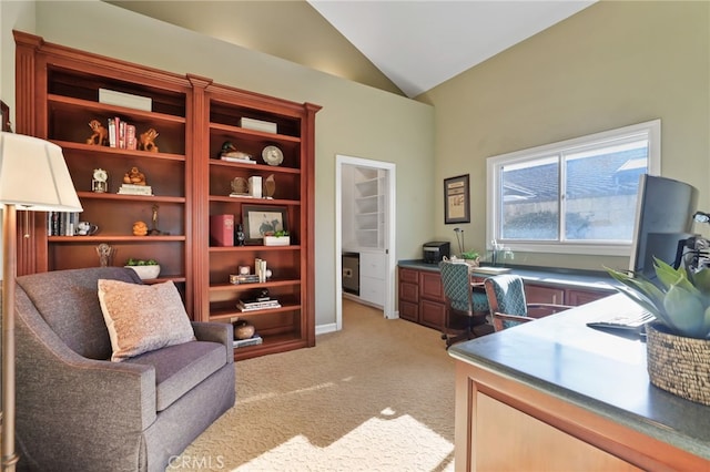 office featuring light carpet and vaulted ceiling