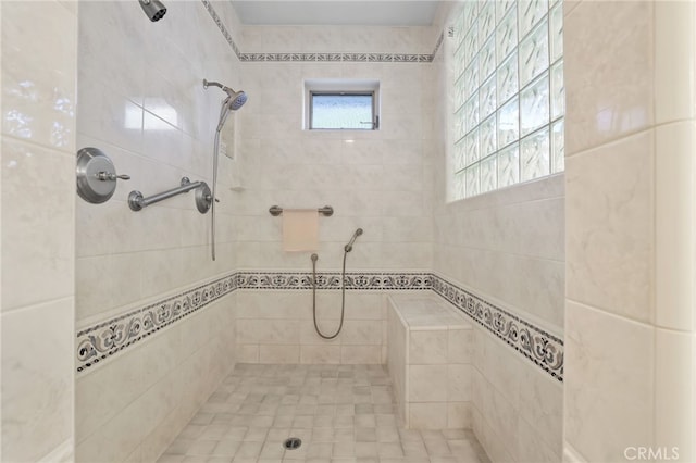 full bathroom featuring a tile shower