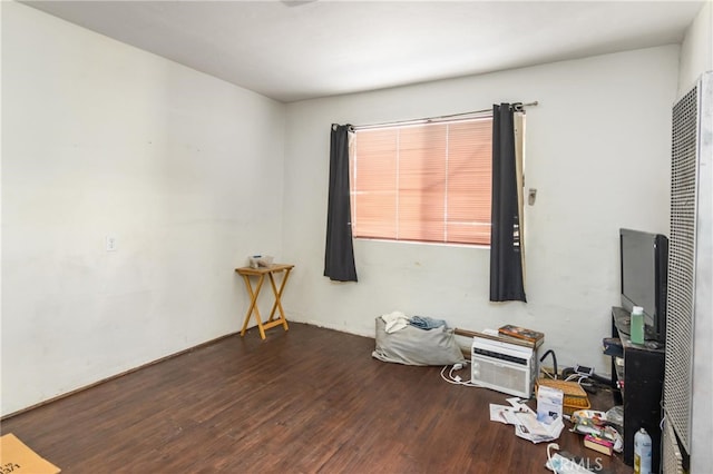 spare room featuring wood finished floors