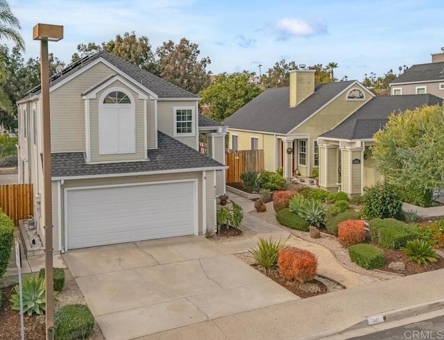 view of front of property with a garage, roof with shingles, and fence