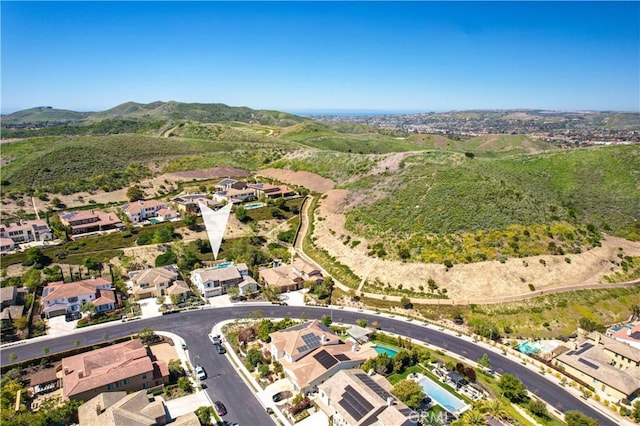 bird's eye view with a residential view and a mountain view