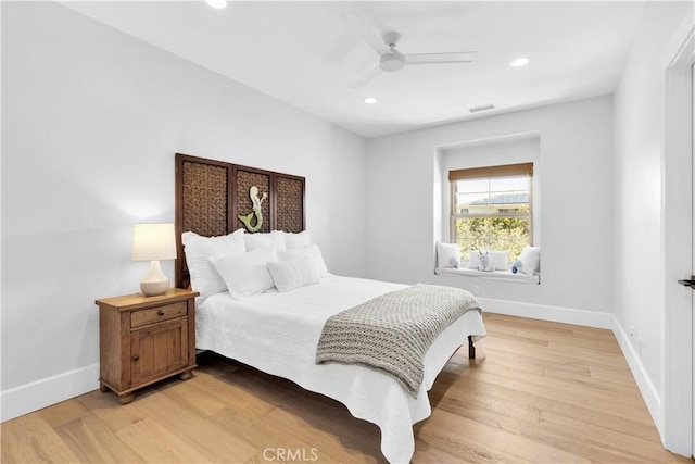 bedroom featuring light wood-type flooring, visible vents, baseboards, and recessed lighting