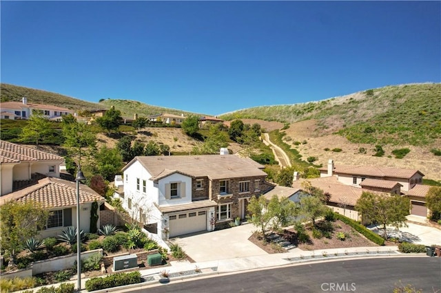 birds eye view of property with a mountain view