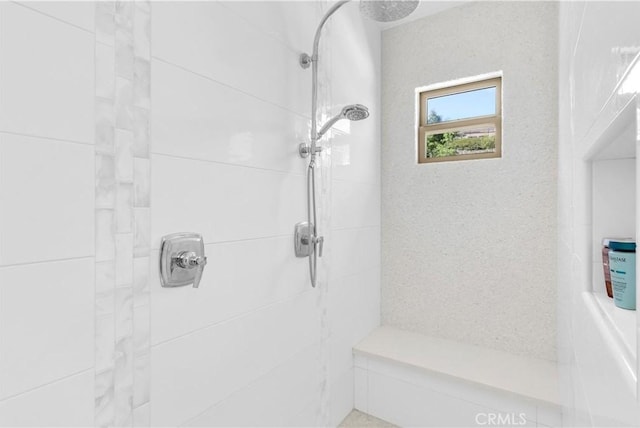 bathroom featuring tiled shower