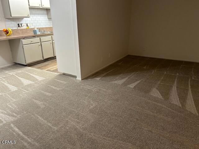 empty room with light colored carpet