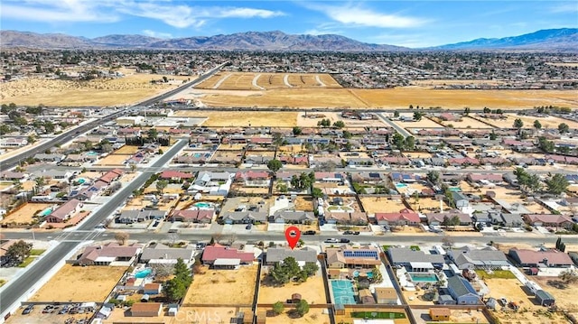 drone / aerial view with a residential view and a mountain view