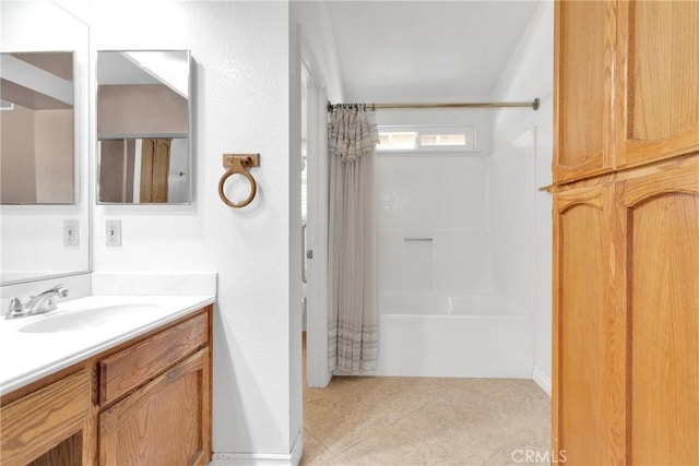 bathroom with tile patterned floors and vanity