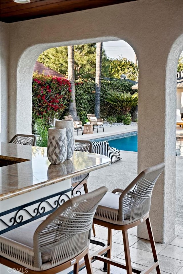 view of patio featuring an outdoor pool