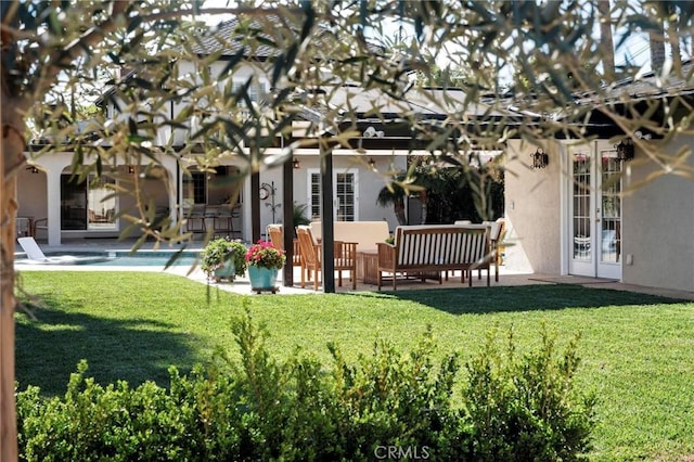 view of yard with an outdoor pool, french doors, a pergola, and a patio area