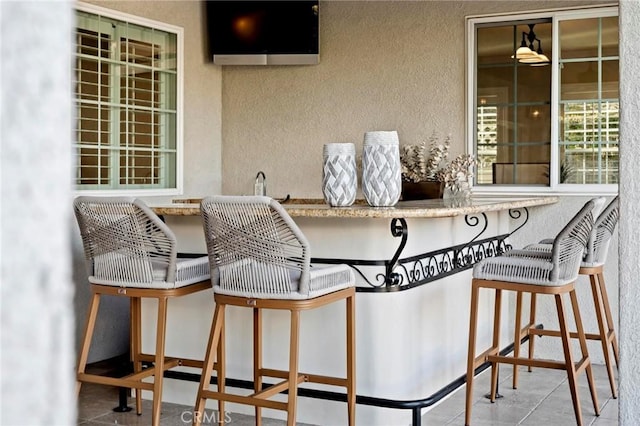 view of patio / terrace featuring outdoor dry bar