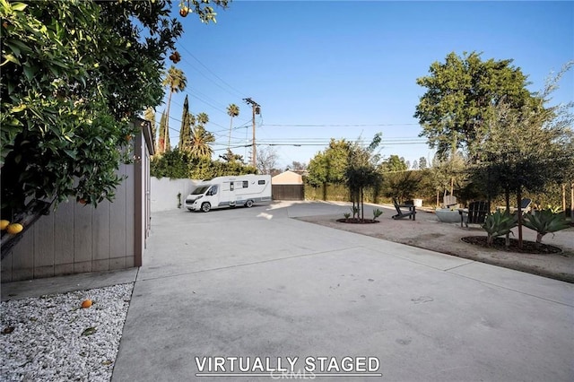 view of street featuring concrete driveway