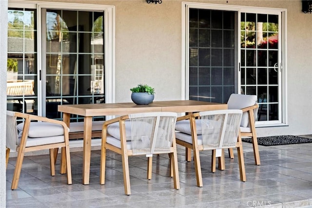 view of patio featuring outdoor dining area