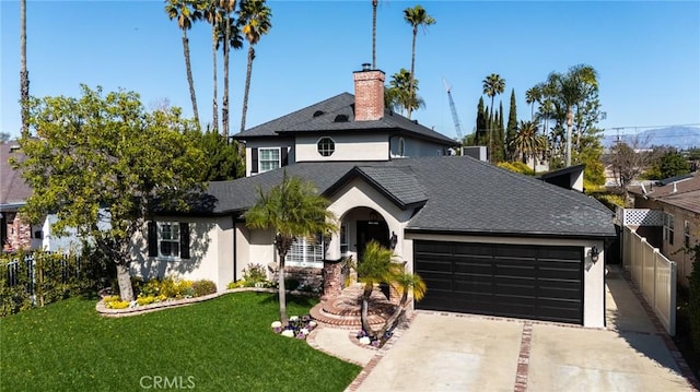 view of front of property featuring a garage, stucco siding, and fence