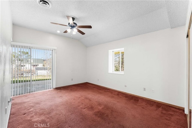 21013 Carriage Dr, Tehachapi, CA 93561 - carpeted empty room with baseboards, visible vents, a ceiling fan, lofted ceiling, and a textured ceiling