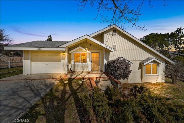 21013 Carriage Dr, Tehachapi, CA 93561 - mid-century home featuring concrete driveway, fence, and an attached garage
