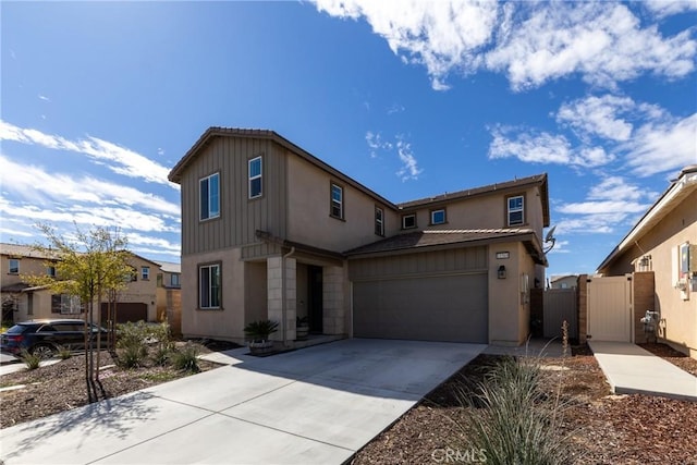 view of front facade featuring driveway, an attached garage, a gate, and a residential view