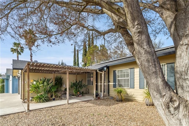 single story home with a pergola