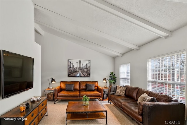 living area featuring lofted ceiling with beams, a textured ceiling, and carpet flooring