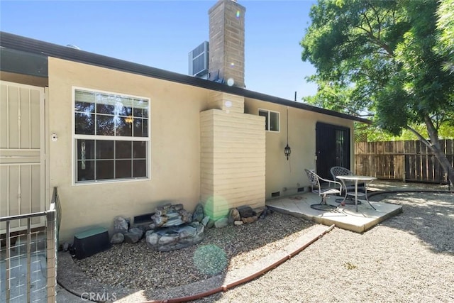 2655 Marseille Way, Stockton, CA 95209 - rear view of property with a patio, stucco siding, and a chimney