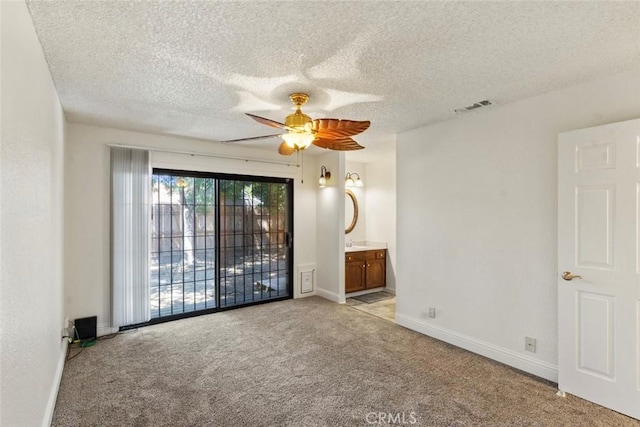 2655 Marseille Way, Stockton, CA 95209 - spare room with light colored carpet, ceiling fan, a textured ceiling, and baseboards