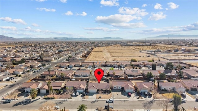 drone / aerial view featuring a mountain view and a residential view