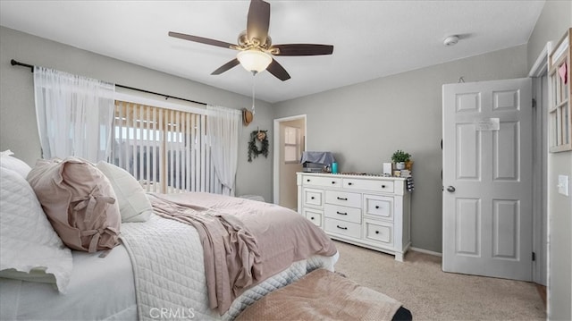 bedroom with light carpet, ceiling fan, and access to exterior