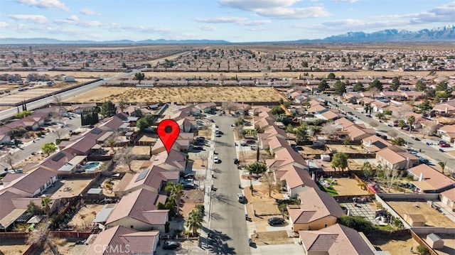 aerial view with a residential view, a desert view, and a mountain view