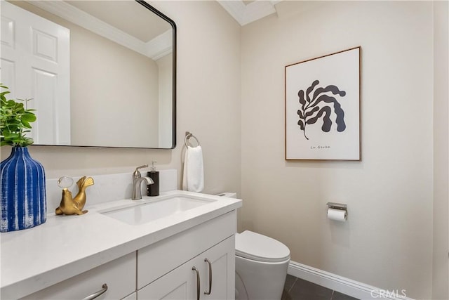 bathroom with tile patterned floors, toilet, ornamental molding, baseboards, and vanity