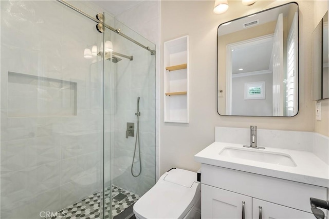 bathroom with a shower stall, vanity, and toilet