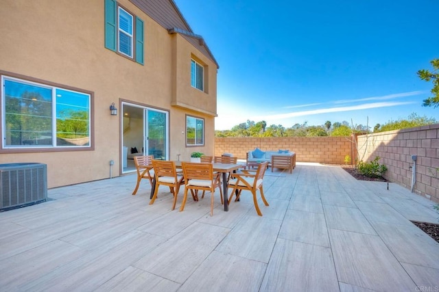 view of patio / terrace featuring cooling unit, outdoor dining area, a fenced backyard, and an outdoor living space