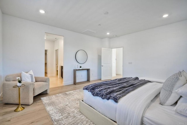 bedroom featuring recessed lighting, baseboards, and light wood finished floors