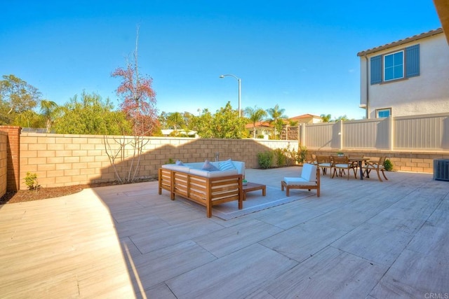 view of patio / terrace featuring a fenced backyard, an outdoor hangout area, and cooling unit