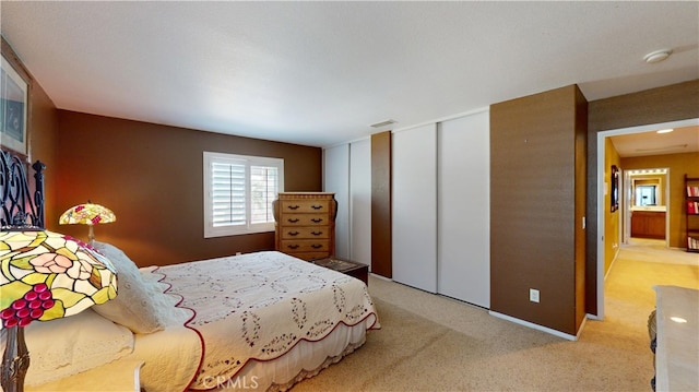 bedroom with light carpet and visible vents