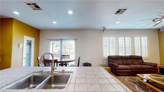 11318 Fitzpatrick Dr, Rancho Cucamonga, CA 91730 - kitchen with a sink, tile countertops, ceiling fan, recessed lighting, and open floor plan