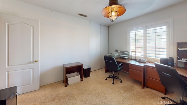 home office featuring visible vents and light carpet