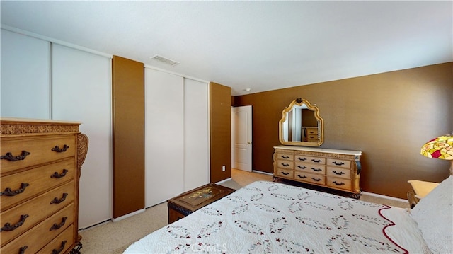 bedroom featuring visible vents