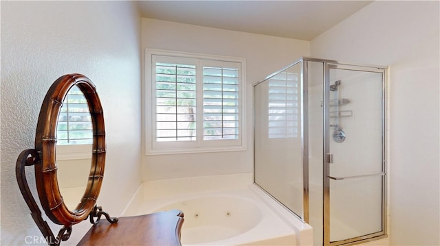 full bath with a jetted tub and a shower stall