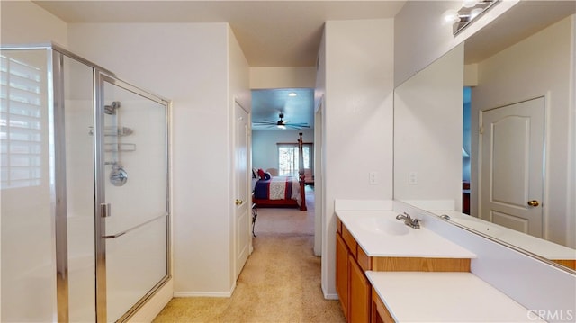 ensuite bathroom with a stall shower, connected bathroom, vanity, and a ceiling fan