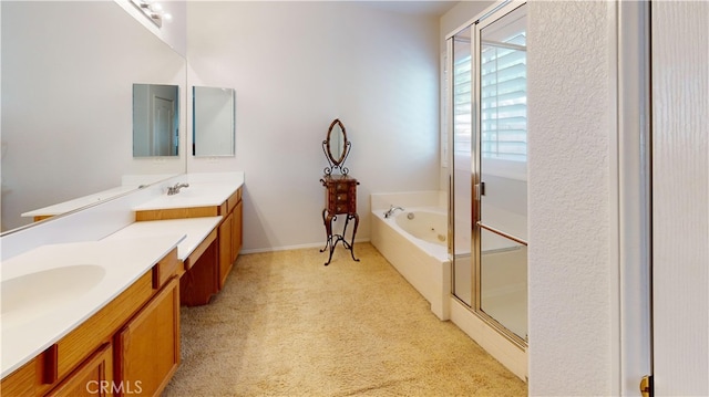 bathroom featuring a jetted tub, carpet, a shower stall, and vanity