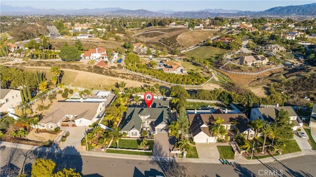 bird's eye view with a residential view and a mountain view