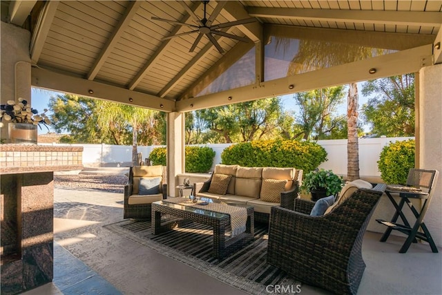 view of patio / terrace featuring ceiling fan, a fenced backyard, and outdoor lounge area